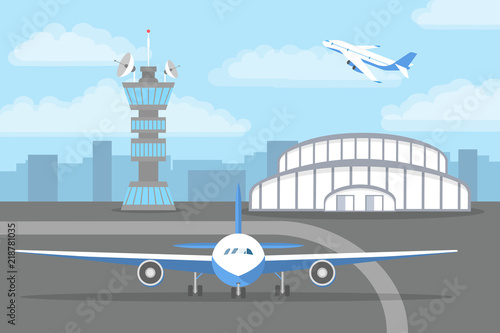 Aircarft standing on landing strip in front of airport