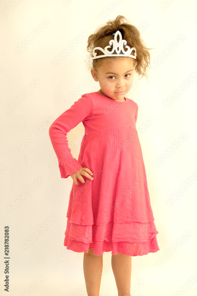 Little girl in pink dress and tiara fun poses Little girl in pink dress and tiara fun poses