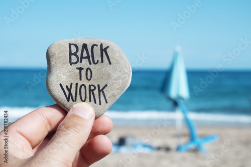 Canvas Print folded beach umbrella and text back to work