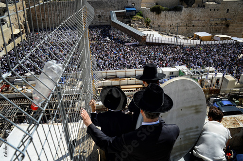 Religious Jews pray at the Western Wall in Jerusalem. Prayer of the Coens in honor of the Jewish holiday Pesach photo