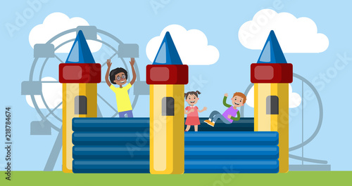 Children play in the bouncy castle in amusement park