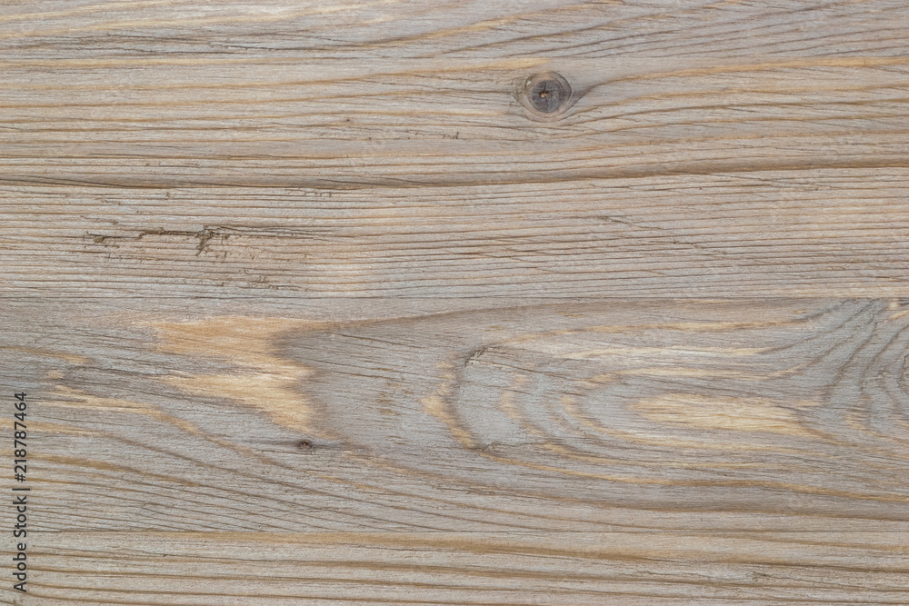 Naklejka premium Old rustic scratch and damage grey wood texture close-up as background.