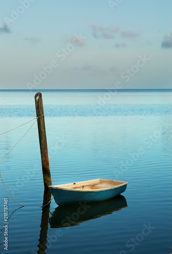Wallpaper Mural Solitary small boat moored at soft blue sunrise in the Florida Keys Torontodigital.ca