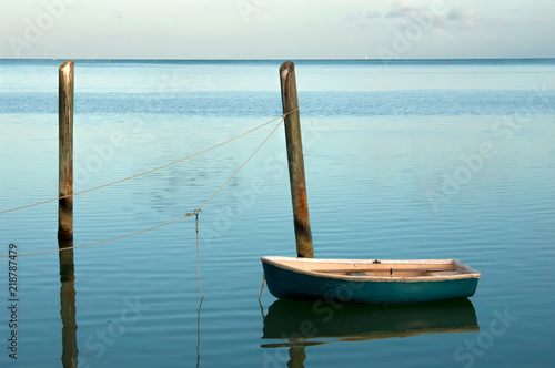 Wallpaper Mural Solitary small boat moored at soft blue sunrise in the Florida Keys Torontodigital.ca