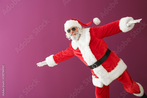 Cool Santa Claus on color background