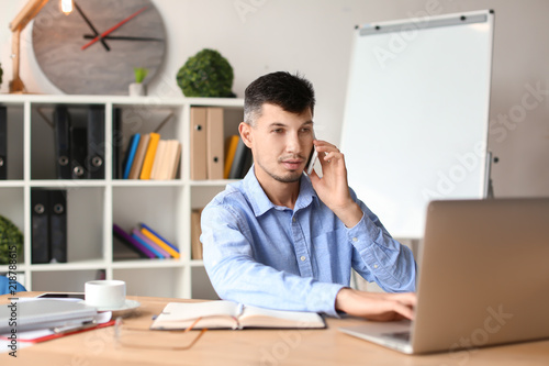 Businessman talking on phon...