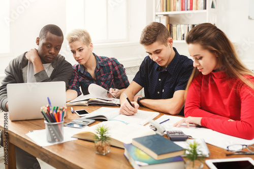 Multiethnic classmates preparing for exams together