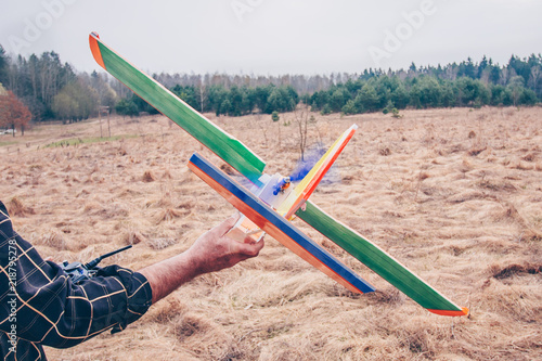 Father and son launches radio-controlled model of the aircraft photo