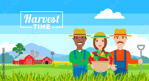 harvest time . farmers team with vegetables basket  standing in field. organic agriculture