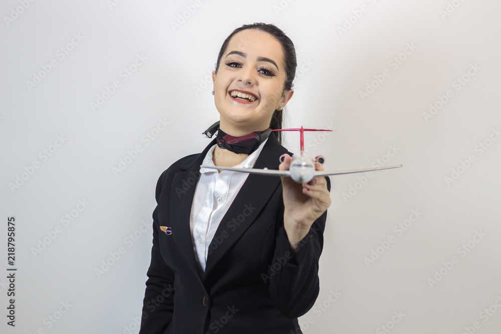 Beautiful stewardess. Studio shot with fly attendant woman. Beautiful stewardess. Studio shot with fly attendant woman.