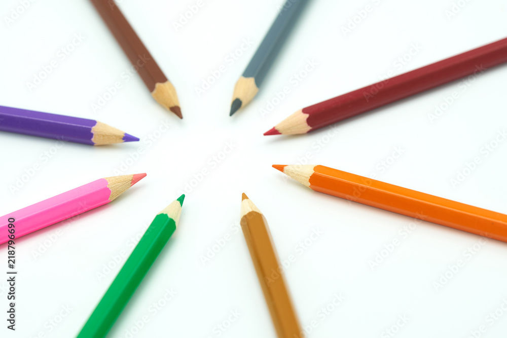 Colorful wooden pencils surround a circle on a white background. Make a center Can be used as background or fill in text with copy spaces. Colorful wooden pencils surround a circle on a white background. Make a center Can be used as background or fill in text with copy spaces.