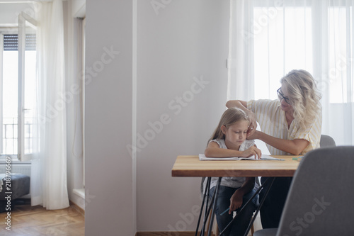 Schoolgirl Learning to Write © LStockStudio
