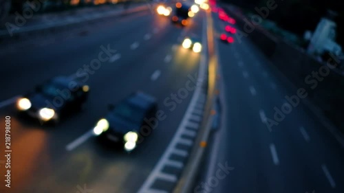 Traffic car lights on the night city street. Video of bokeh of blurred car lights on dusk highway