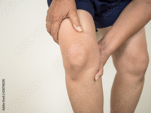 Woman injured leg with calf feeling pain .