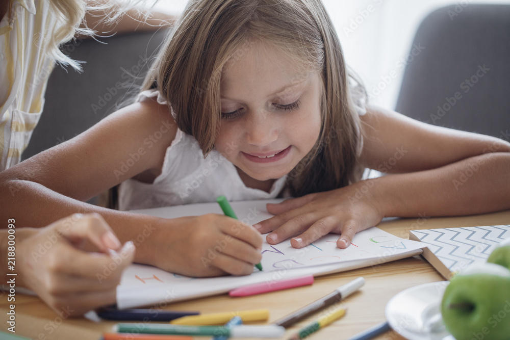 Schoolgirl Writing in Her Notebook Schoolgirl Writing in Her Notebook