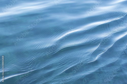 blue clear sea water with small waves