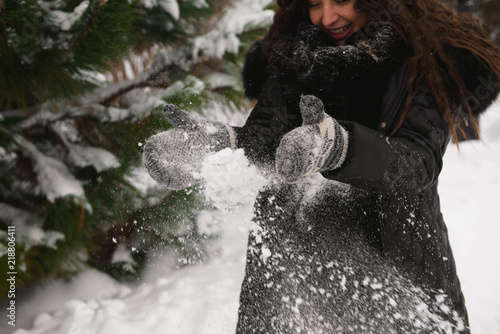 A beautiful outdoor pregnant woman portrait in snowy nature