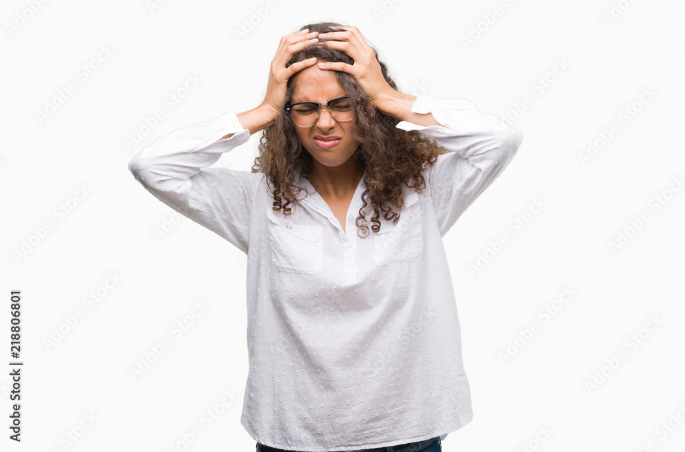 Beautiful young hispanic woman suffering from headache desperate and stressed because pain and migraine. Hands on head. Beautiful young hispanic woman suffering from headache desperate and stressed because pain and migraine. Hands on head.
