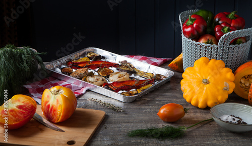 Cut vegetables in a foil grill tray and seasonal vegetables
