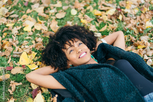 Afro hair style woman daydraming in autumn