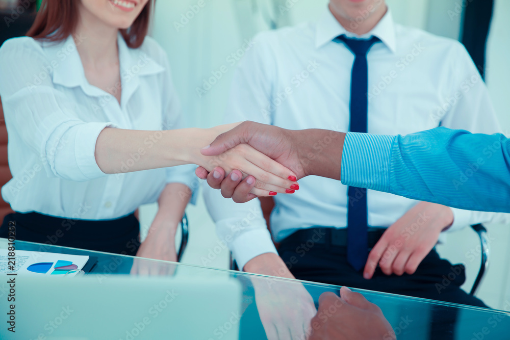handshake between a business woman and investor handshake between a business woman and investor