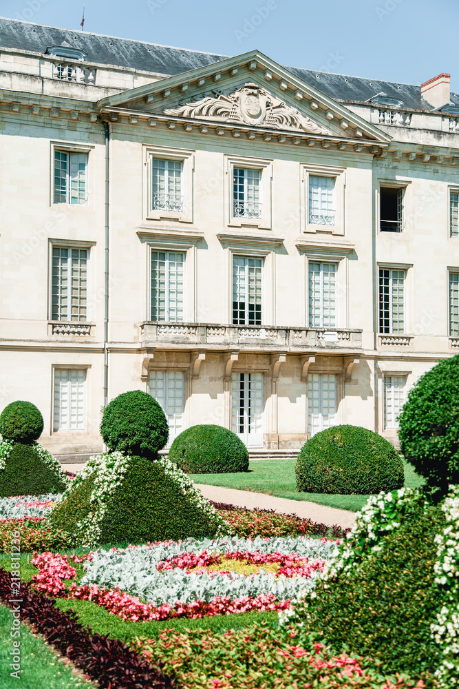 French traditional building with classical garden with geometrical forms. French architecture concept