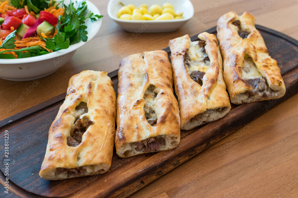 Turkish Bafra Pide with Minced Meat Kavurma Salad and Pickles. Turkish Bafra Pide with Minced Meat Kavurma Salad and Pickles.