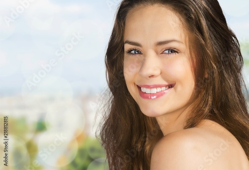 Outdoor summer portrait of pretty young smiling happy woman