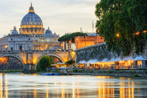 Saint Peter at the Evening Time  Different Point of View - With a Market Close to the Tevere River. The Vatican City situated in Rome the Capital of Italy photo