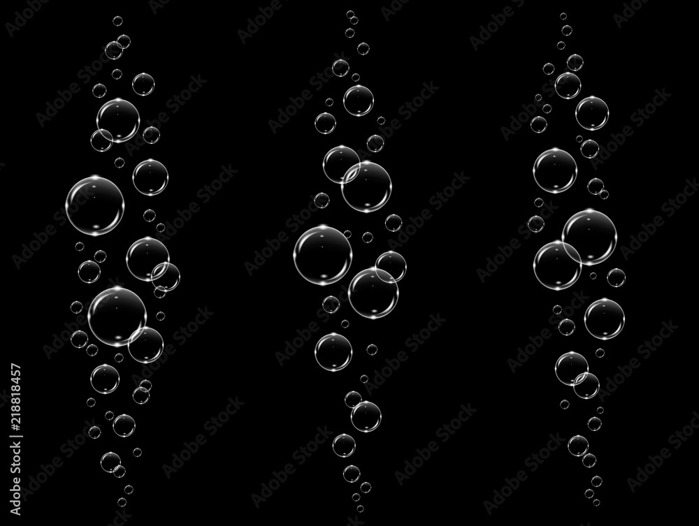 Transparent white bubbles flying in air or underwater, isolated on black background
