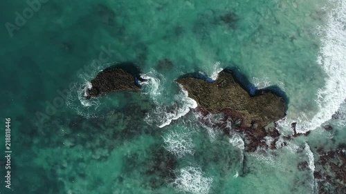 Aerial footage over the small holiday and fishing village of Arniston along the overberg coastline in South Africa