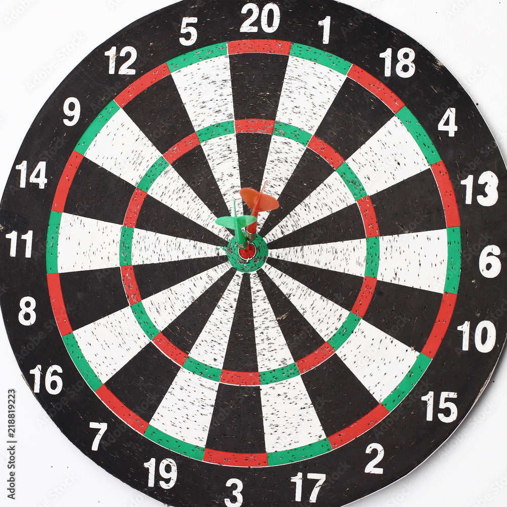 side view.Arrow dart hitting the center of the target dart Board side view.Arrow dart hitting the center of the target dart Board