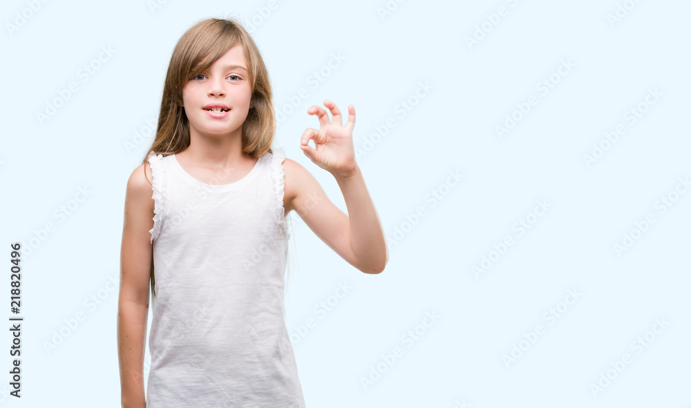 Young blonde toddler doing ok sign with fingers, excellent symbol Young blonde toddler doing ok sign with fingers, excellent symbol