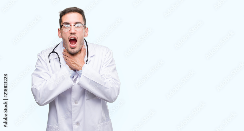 Handsome young doctor man shouting and suffocate because painful strangle. Health problem. Asphyxiate and suicide concept. Handsome young doctor man shouting and suffocate because painful strangle. Health problem. Asphyxiate and suicide concept.