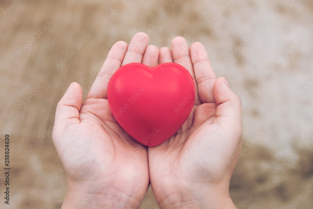 Red heart ball : Stress reliever foam ball the red heart shape on woman hand. Gift valentine's Day Red heart ball : Stress reliever foam ball the red heart shape on woman hand. Gift valentine's Day