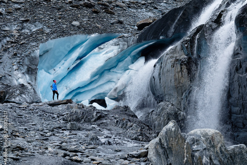 Hiker at the toe of the Worthington Glacier near Valdez, Alaska