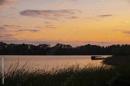 Fototapeta Naklejka Na Ścianę i Meble -  Elk, Poland - Panoramic sunset view over the Elckie lake in the town of Elk