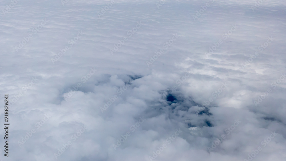 A soft clouds covered the sky look from window plane A soft clouds covered the sky look from window plane