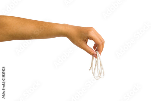 A cropped of female hand holding white rope against white background include clipping path.
