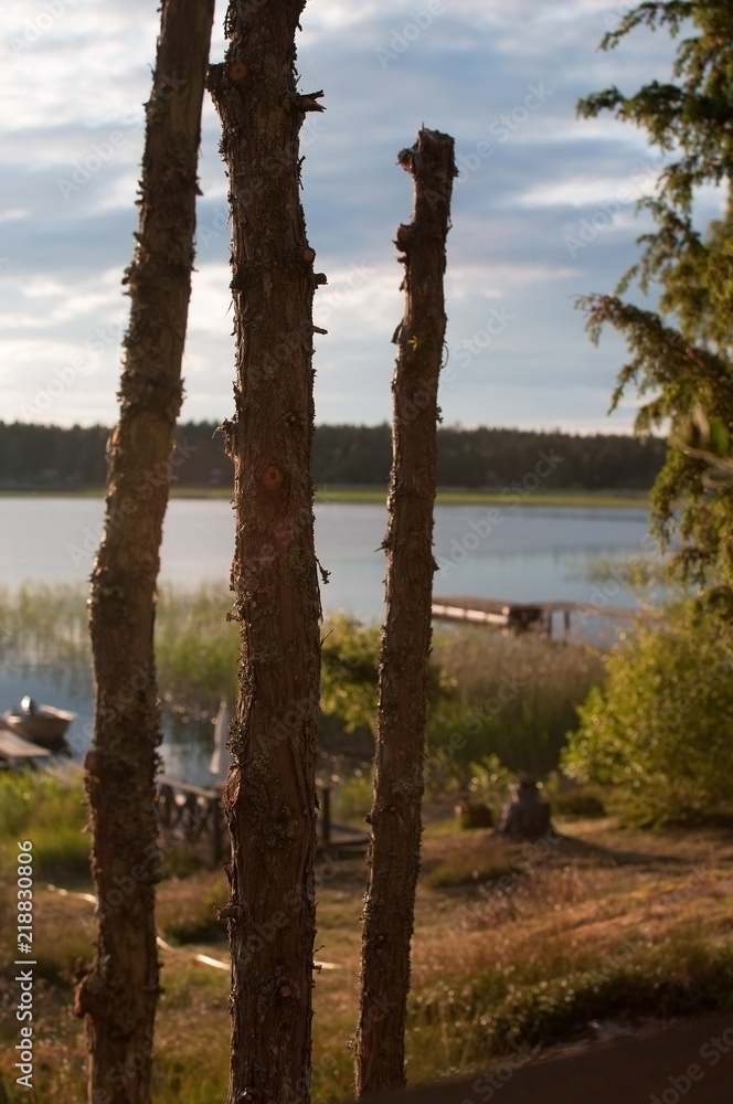 Summer sunset by the lake in Varmland Sweden three sticks