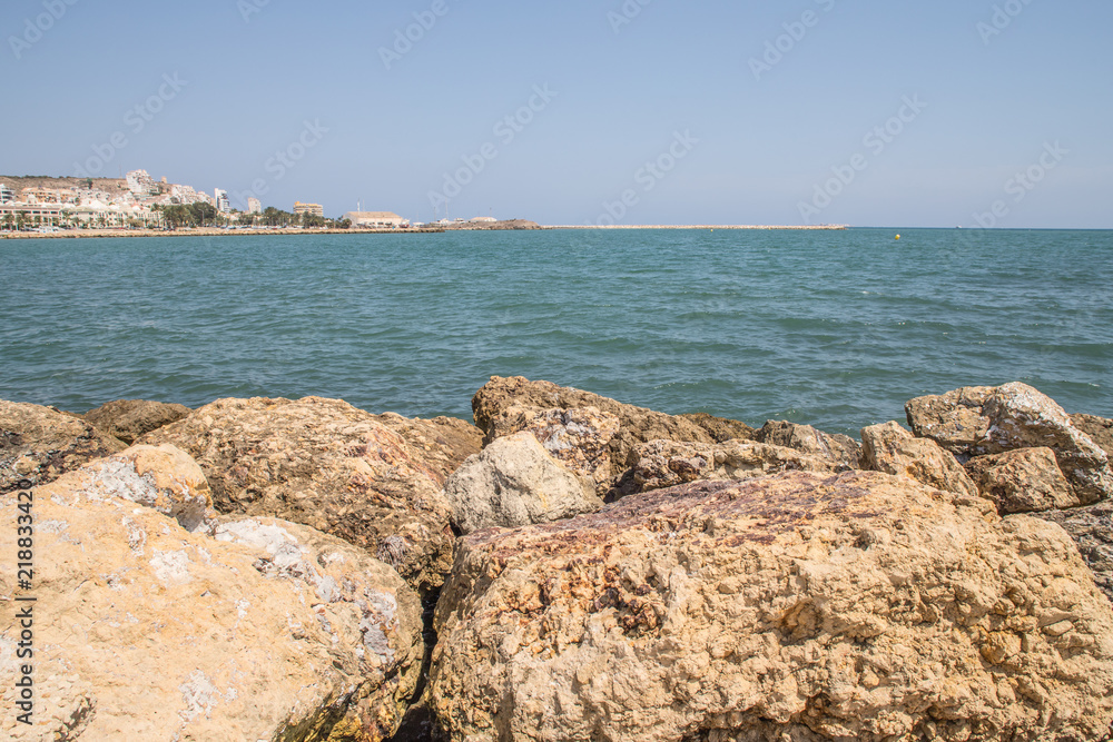beautiful beach with rocks and calm waters