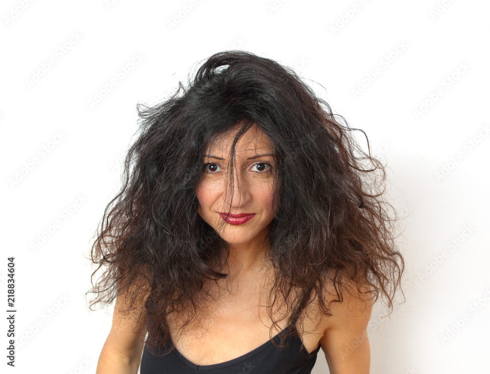 Disheveled attractive young woman on white background Disheveled attractive young woman on white background