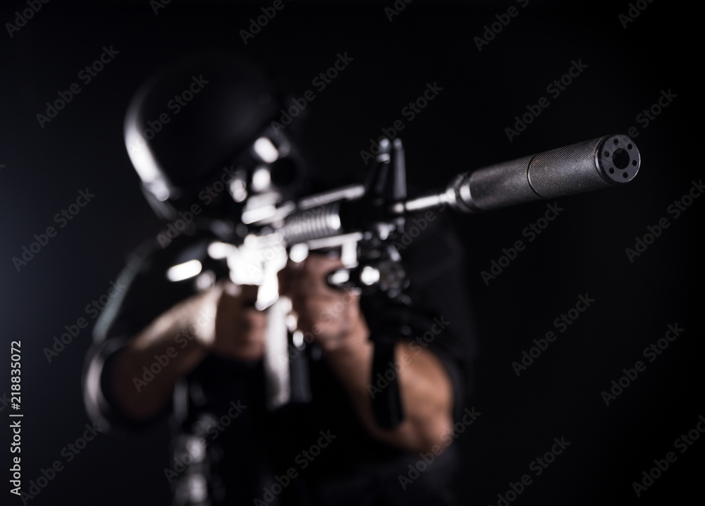 Naklejka premium Spec ops police officer SWAT in black uniform