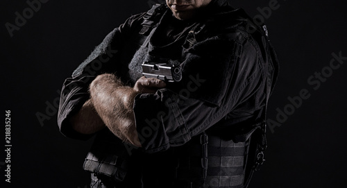 Spec ops police officer SWAT in black uniform