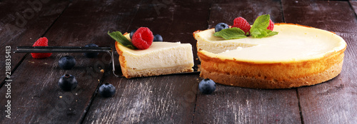 Homemade cheesecake with fresh raspberries and mint for dessert - healthy organic summer dessert pie cheesecake. Vanilla Cheese Cake