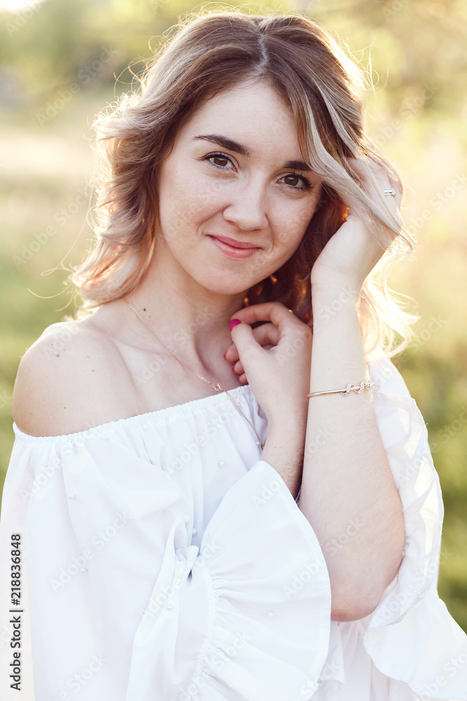 Portrait of a sensual young woman with sun rays on a background. Portrait of a sensual young woman with sun rays on a background.