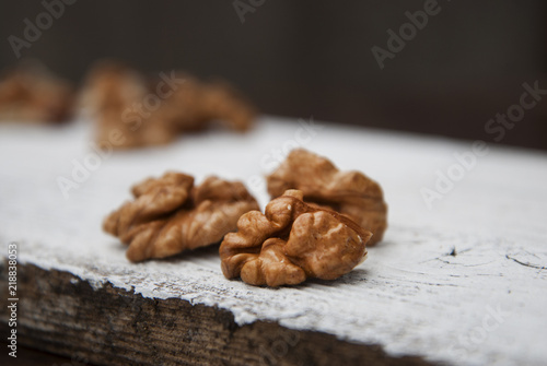 Nut isolated on a white wooden background. Healthy food. Rustc style. photo