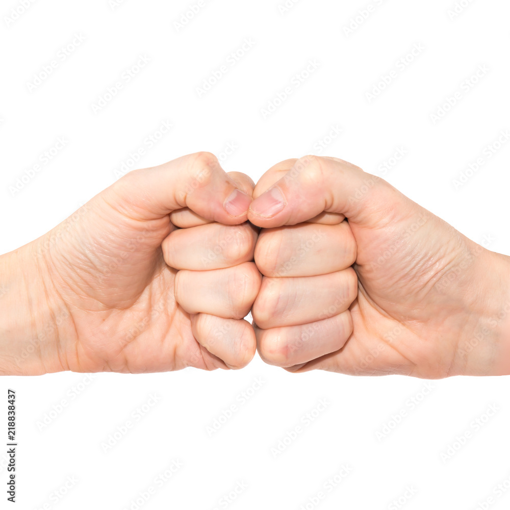 Two hands with fists bumping isolated on white background Two hands with fists bumping isolated on white background