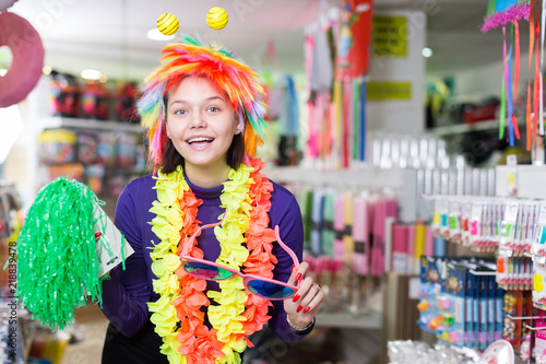 Girl joking in festive accessories shop