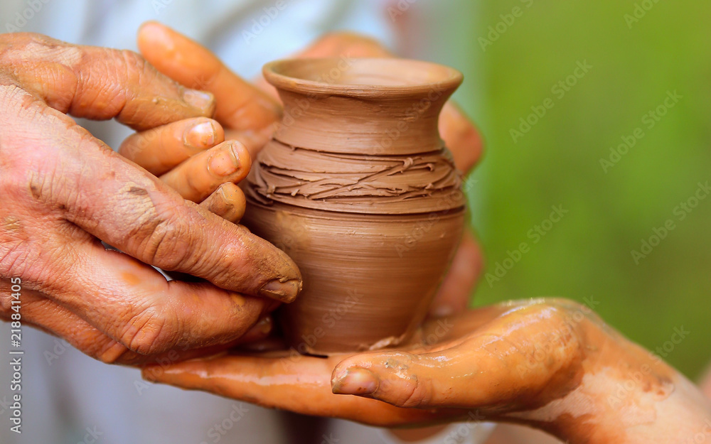 Closeup pot sculpted in clay Closeup pot sculpted in clay
